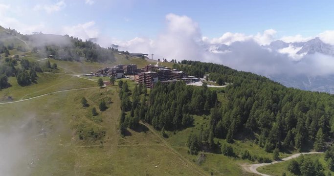 Thyon lateral traveling in clouds - Aerial 4K - Phantom 4 PRO