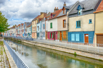 Fototapeta na wymiar Houses next to canal or river in Amiens