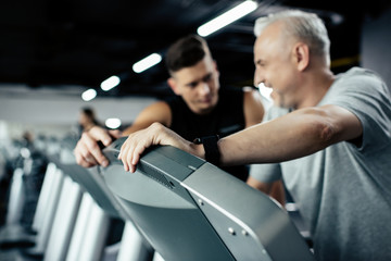 Fototapeta na wymiar senior sportsman on treadmill