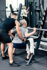 Fototapeta na wymiar senior sportsman lifting barbell