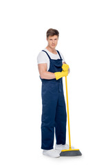 cleaner in rubber gloves with broom