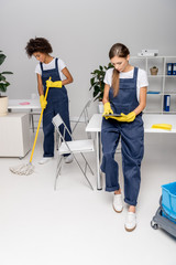 Fototapeta na wymiar female cleaners working together