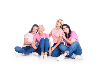 Fototapeta na wymiar women in pink t-shirts with ribbons