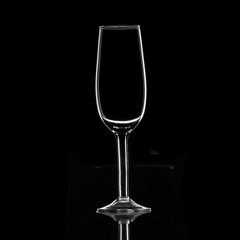White silhouette of a wine glass on a dark background