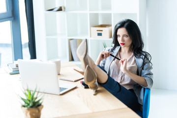 businesswoman at workplace with laptop