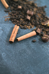 Sweet still life. Coffee beans, chocolate bars and cinnamon sticks.