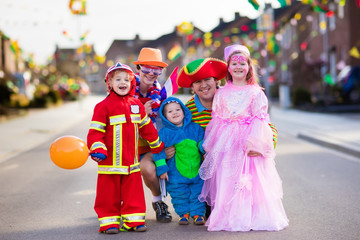 Kids and parents on Halloween trick or treat