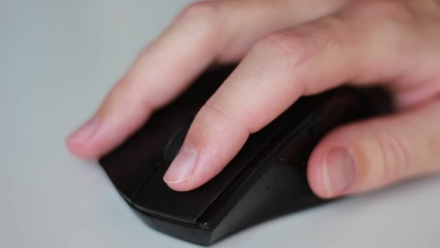 Working with black mouse closeup