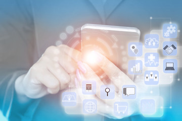business woman hand holding smart phone with technology icons and connection background