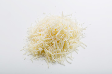 close up of grated cheese, on white background