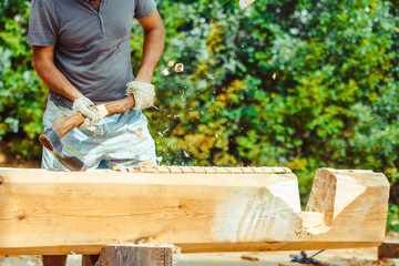 a man cuts a log