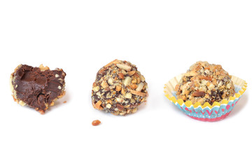 Chocolate ganache truffles with almond on white background - isolated