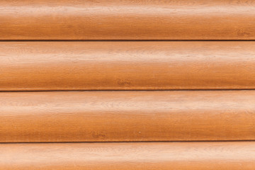 Wall of a plastic siding log house wall with texture and wood pattern simulation knots exterior