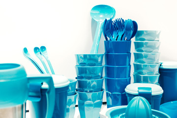 Set of blue dishes on table on light background