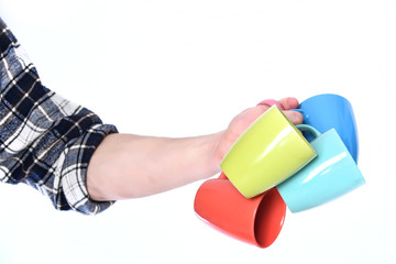 guy hand holding colorful cups