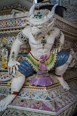 Fototapeta premium Traditional Thai style sculptures and painting of monster,animals and gods in church under decoration of Wat Pariwat