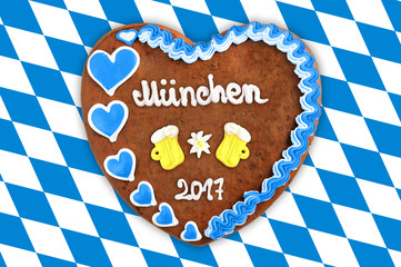 Obraz premium Oktoberfest Gingerbread heart 2017 on white blue bavarian flag background