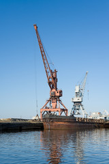wharf with hoisting cranes