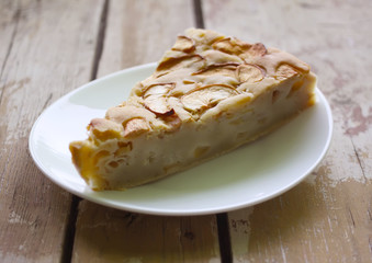 Homemade sweet apple pie with cinnamon and and powdered sugar.