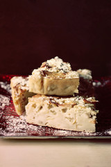 Homemade sweet apple pie with cinnamon and powdered sugar.