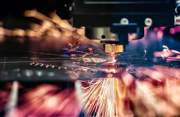 CNC Laser cutting of metal, modern industrial technology. - obrazy, fototapety, plakaty