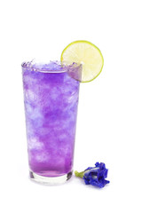 Butterfly pea juice with ice in transparent cup serve on wooden table with flower.