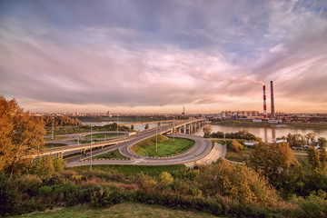 panorama of city center Kemerovo on river Tom with two bridges under colorful cloudy sky Siberia,...