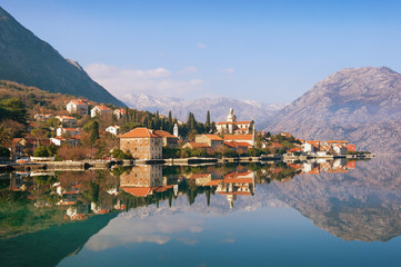 Fototapeta premium View of seaside Prcanj town on a sunny winter day. Bay of Kotor (Adriatic Sea), Montenegro