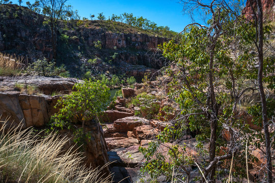 Rocky escarpment on the sides of the river at Katherine Gorge on a beautiful sunny day in Nitmiluk National Park, Northern Territory, Australia.