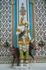 Traditional Thai style sculptures and painting of monster,animals and gods in church under decoration of Wat Pariwat