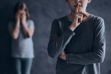 Scared children suffering in silence