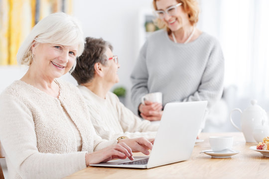 Elderly woman doing online shopping