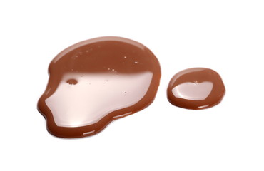 Obraz na płótnie Canvas Spilled chocolate milk puddle isolated on white background