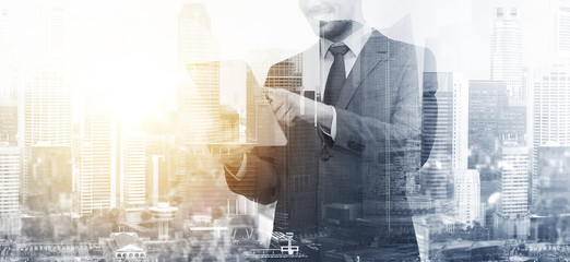 smiling businessman with tablet pc computer