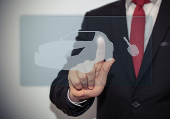 Close up of businessman touching car icon on virtual screen