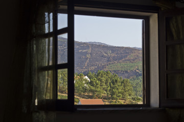 Open  window with a view to the mountain