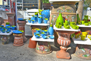 Cretan pottery displayed outside a shop in the village centre, Kavros, Crete, Greece