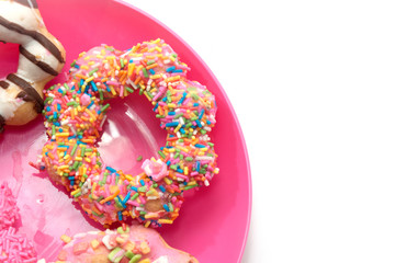 colorful doughnut on pink plate