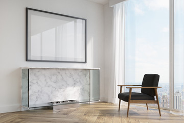 White living room, fireplace and black armchair