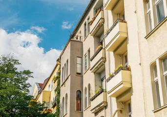 Fototapeta na wymiar yellow apartment buildings in summer