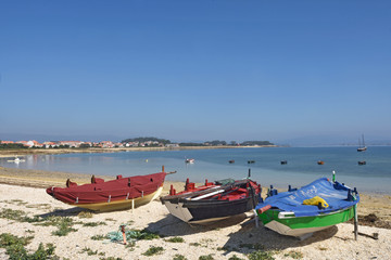 Fototapeta na wymiar Arousa Island boats on the beach Praia Boa Norte, Pontevedra province, Galicia, Spain