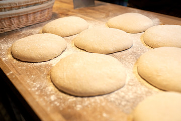 Fototapeta na wymiar yeast bread dough on bakery kitchen table