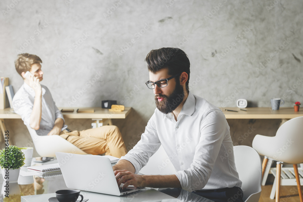 Canvas Prints Attractive businessman using laptop