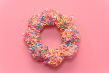 colorful doughnut on pink background