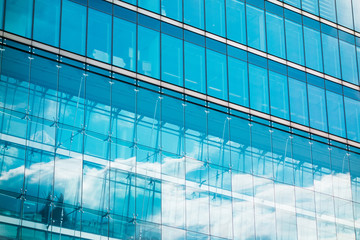 Plakat sky reflections in glass facade