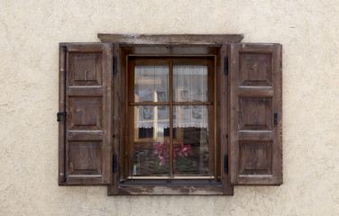 Old wooden window with shutters