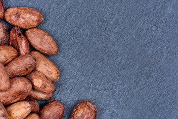 Heap of cacao beans on slate