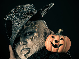 Man with orange pumpkin