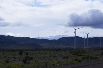 power connections to the car, giant electric poles. electric, wind and traditional energy