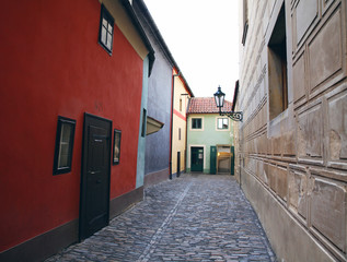 Small colorful houses on the golden street. Prague, Czech Republic